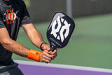 Evoke Premier Pickleball Paddle in guys hands