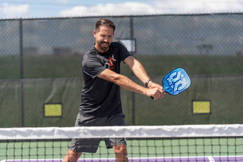 Maverick Pickleball Paddle in guys hands lifestyle